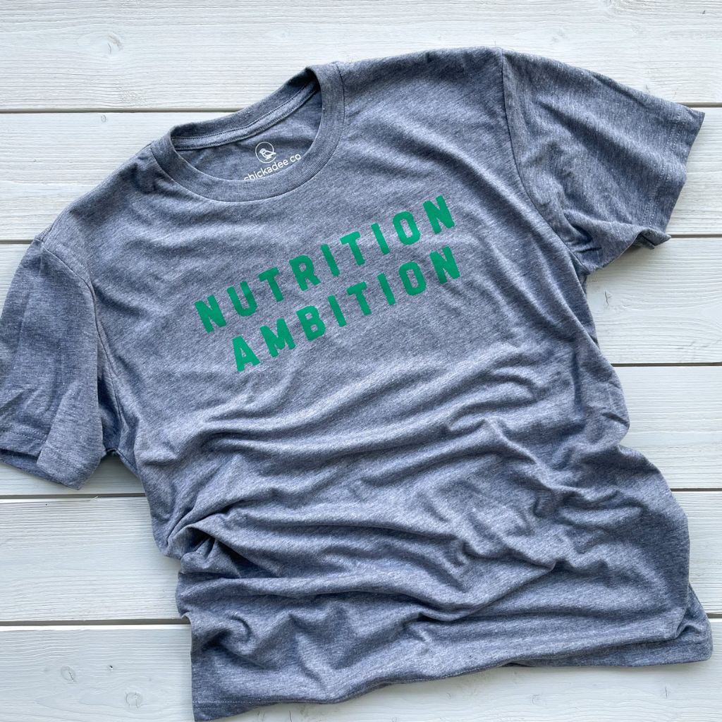 nutrition ambition green text saying on vintage gray unisex tshirt.  heather gray tee with screen printed nutrition ambition text.  wellness apparel.