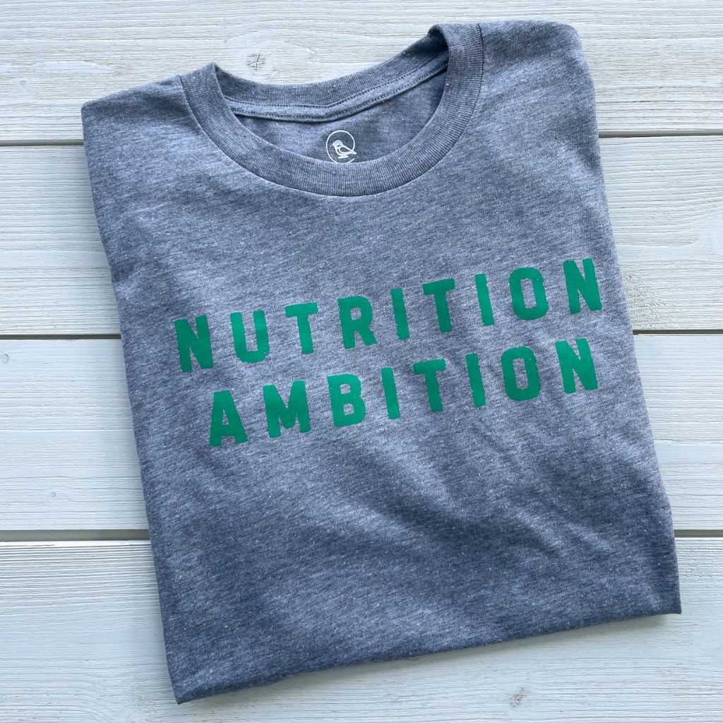nutrition ambition green text saying on vintage gray unisex tshirt.  heather gray tee with screen printed nutrition ambition text.  wellness apparel.