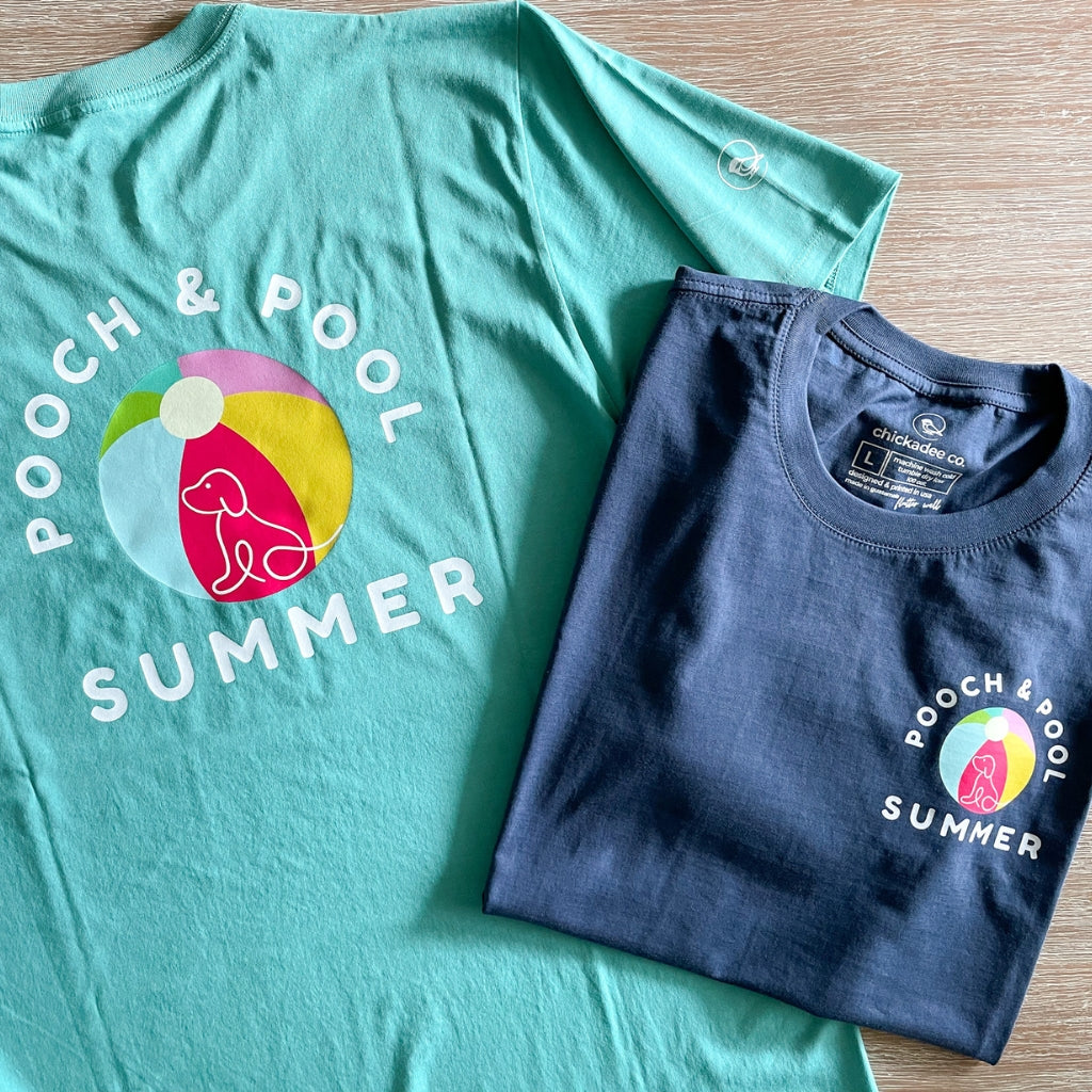 small pooch & pool summer text with graphic on front left chest.  larger image on the back of the tshirt.  dog tshirt.  relaxed cotton dog tee.  unisex blue dog tee and sea green dog tee.