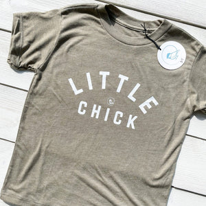 super soft kids tshirt in mossy green with the words LITTLE CHICK & the chickadee co. logo on the front chest.