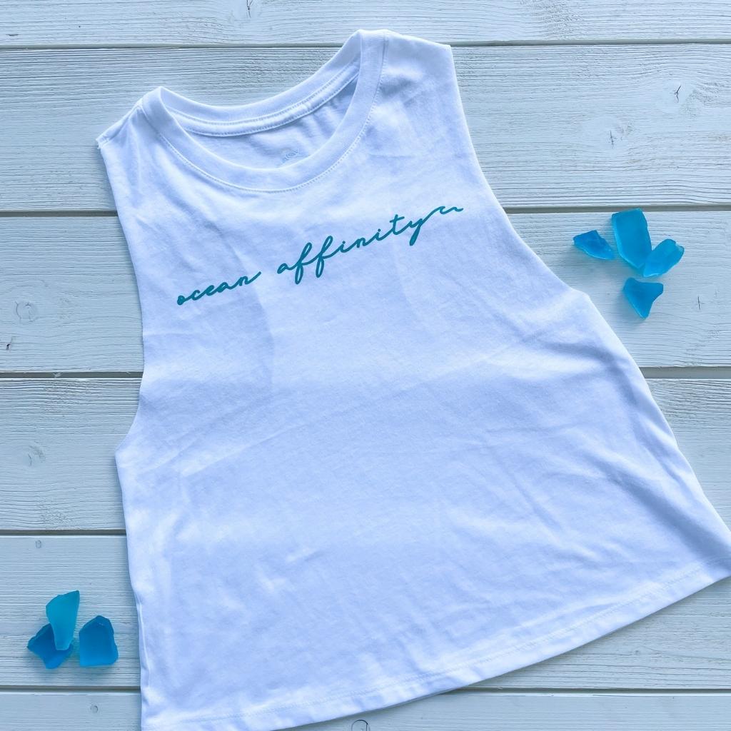 ocean affinity turquoise green script text on bright white racer back tank.  beach tank top.  ocean lovers beach apparel.