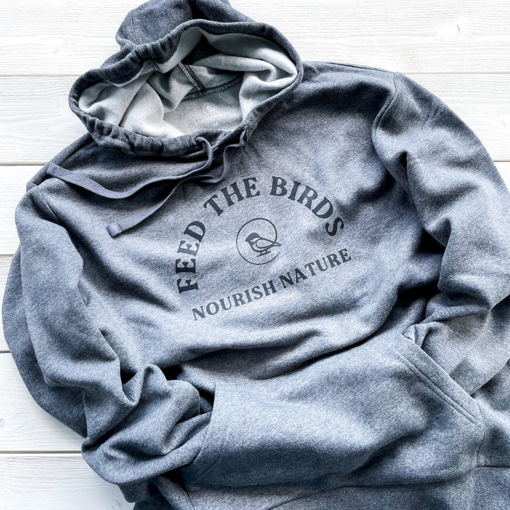 feed the birds nourish nature eco-friendly charcoal colored hoodie.  screen printed text in black with feed the birds & our chickadee co. logo.