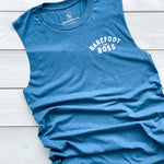 womens muscle tank top crew with fresh cut sleeves.  on the left chest BAREFOOT BOSS is printed in white text on the blue tank.