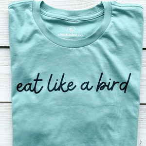 100% organic cotton womens tshirt printed with 'eat like a bird' on the front in black ink, made by chickadee co.
