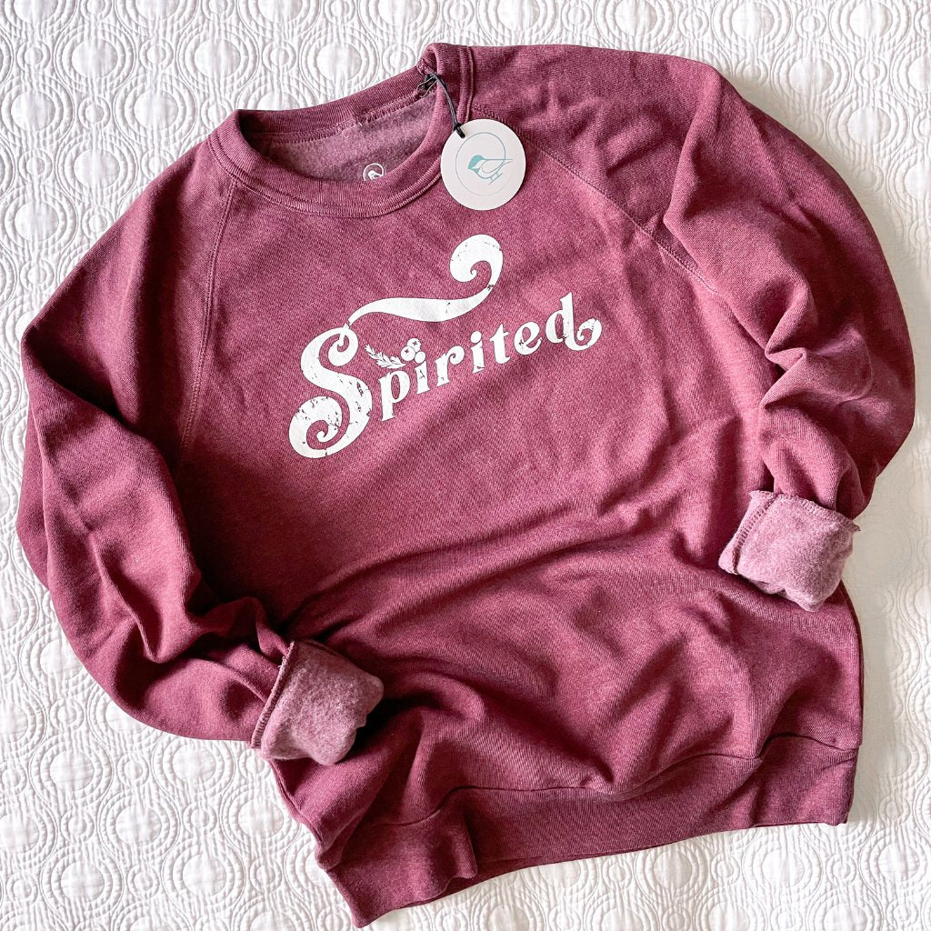 Spirited vintage printed distressed crewneck sweatshirt in a cranberry wine color.  super soft unisex crew sweatshirt.