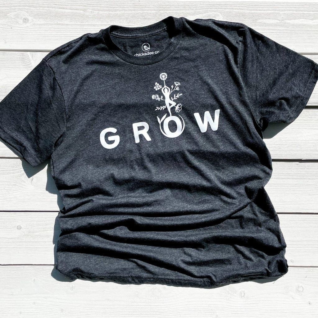 super soft tshirt for women.  wellness shirts with inspirational words.  grow is our word of the year 2023.  heathered black triblend tshirt with white screen printed inks.