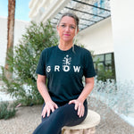 super soft tshirt for women.  wellness shirts with inspirational words.  grow is our word of the year 2023.  heathered black triblend tshirt with white screen printed inks.