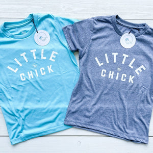 super soft kids tshirts in aqua blue & light gray with the words LITTLE CHICK & the chickadee co. logo on the front chest.